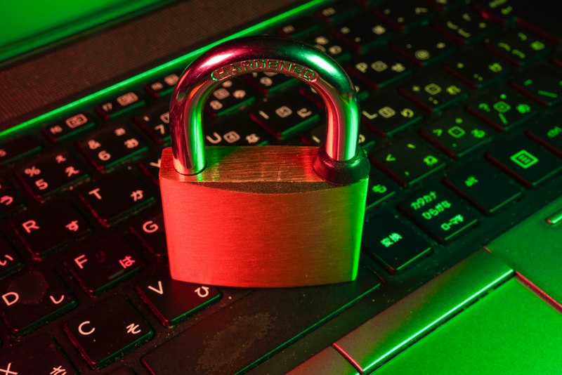 A padlock resting on a computer keyboard